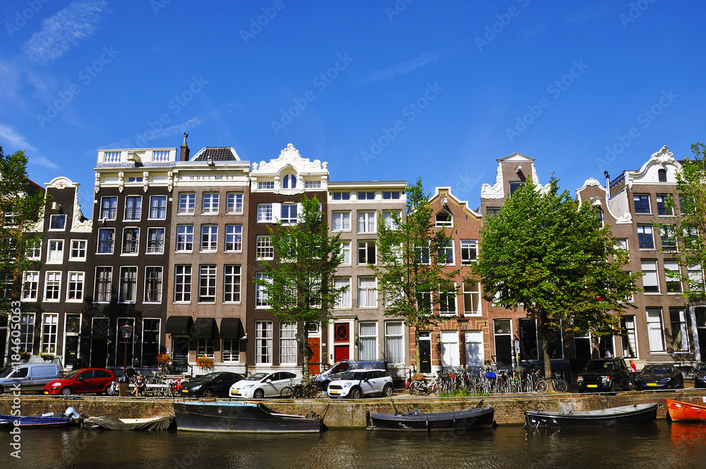 Beautiful colorful buildings with a canal in Amsterdam, Netherlands