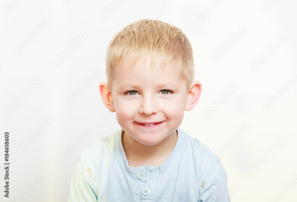 Happy childhood. Portrait of smiling blond boy child kid indoor Happy childhood. Portrait of smiling blond boy child kid indoor