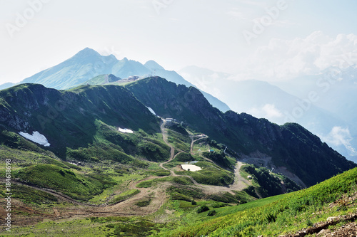 Panorama of the mountains in the area of Krasnaya Polyana/Panorama of Sochi in the Krasnaya Polyana area. There are mountains, clouds, air haze, vegetation. Sochi, Russia, mountain landscape  © VictorL