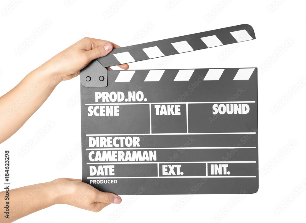 Female hands with clapperboard against white background