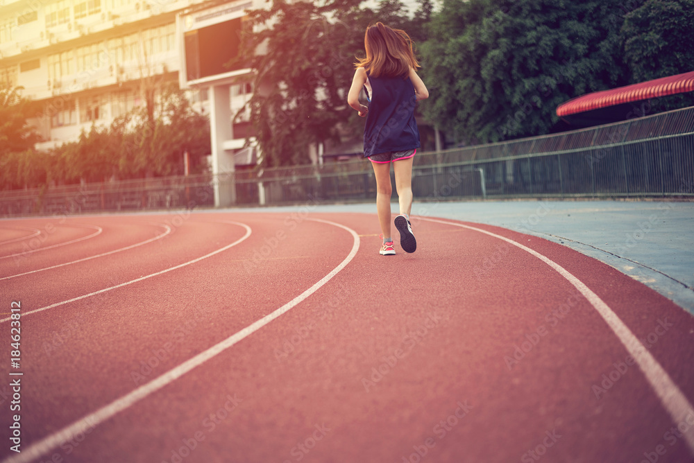 Fototapeta premium Woman are running on track