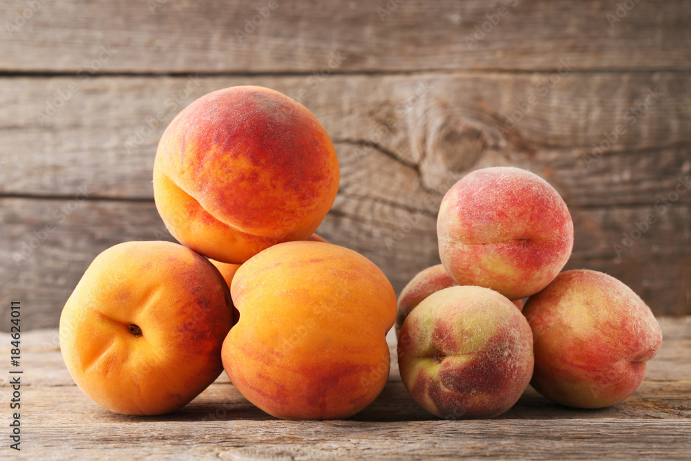 Ripe peaches fruit on grey wooden table Ripe peaches fruit on grey wooden table