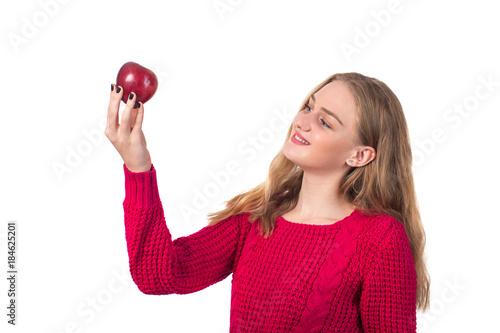 Pretty blonde girl with red apple in her hand, white background