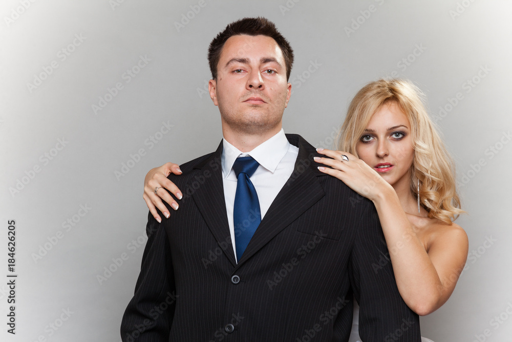 Happy married couple bride groom on gray background Happy married couple bride groom on gray background