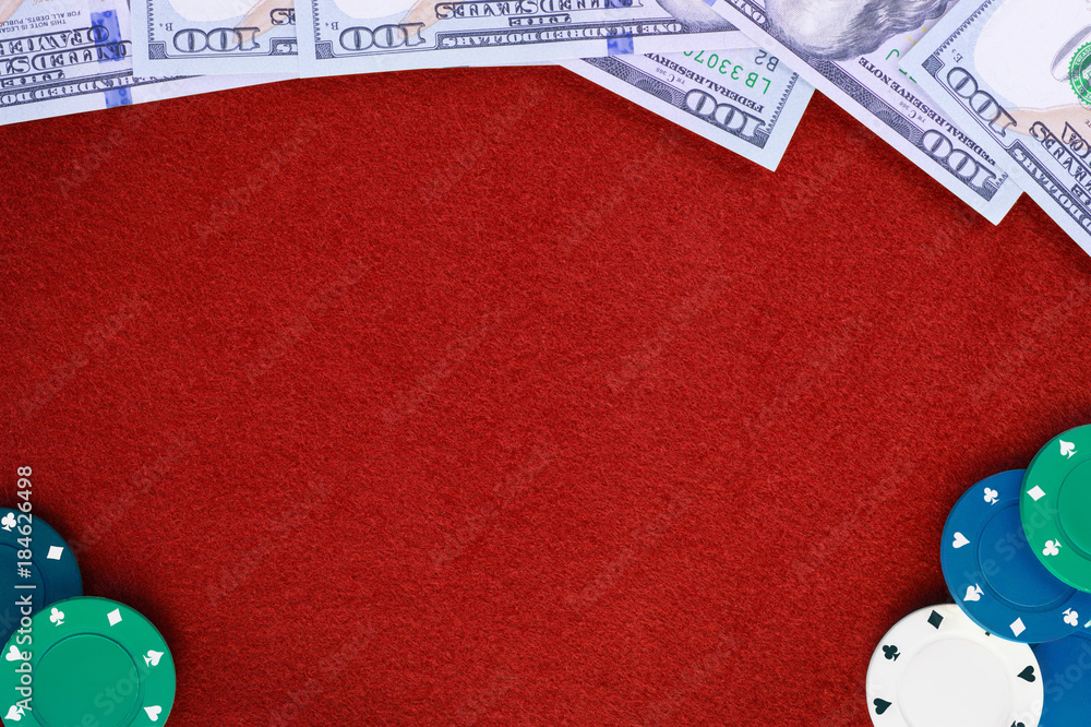 Dollars and poker chips on red casino felt table background