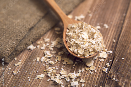 oat flakes in a wooden spoon
