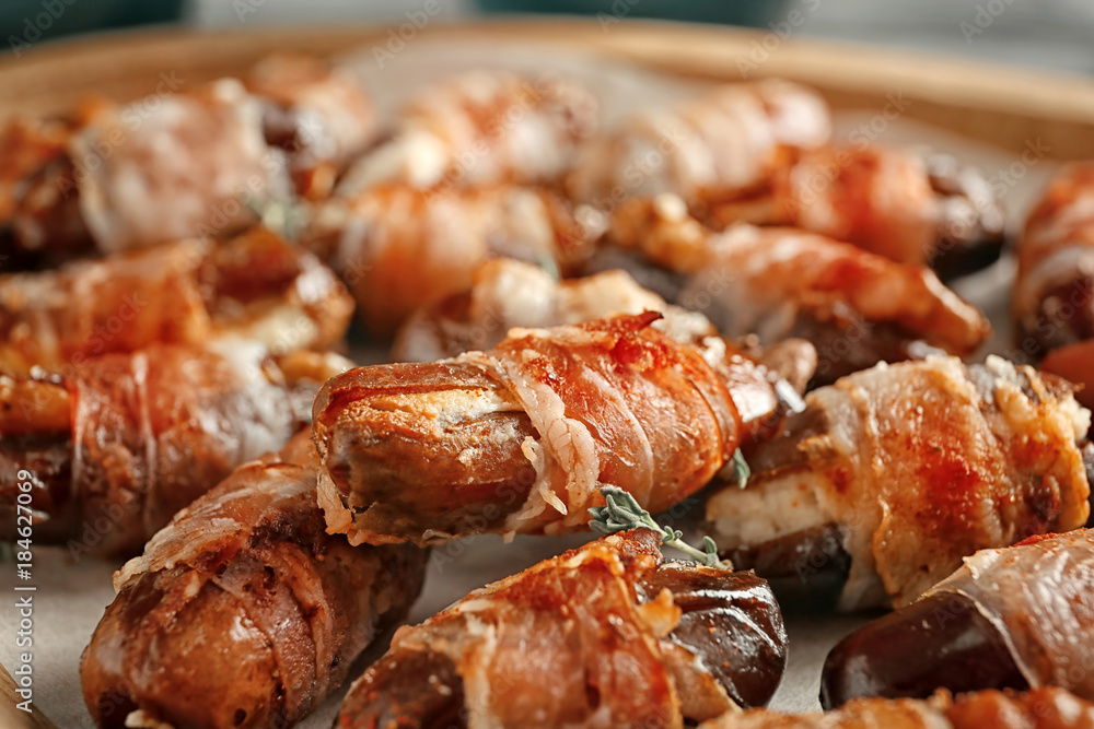 Plate with bacon wrapped dates, closeup