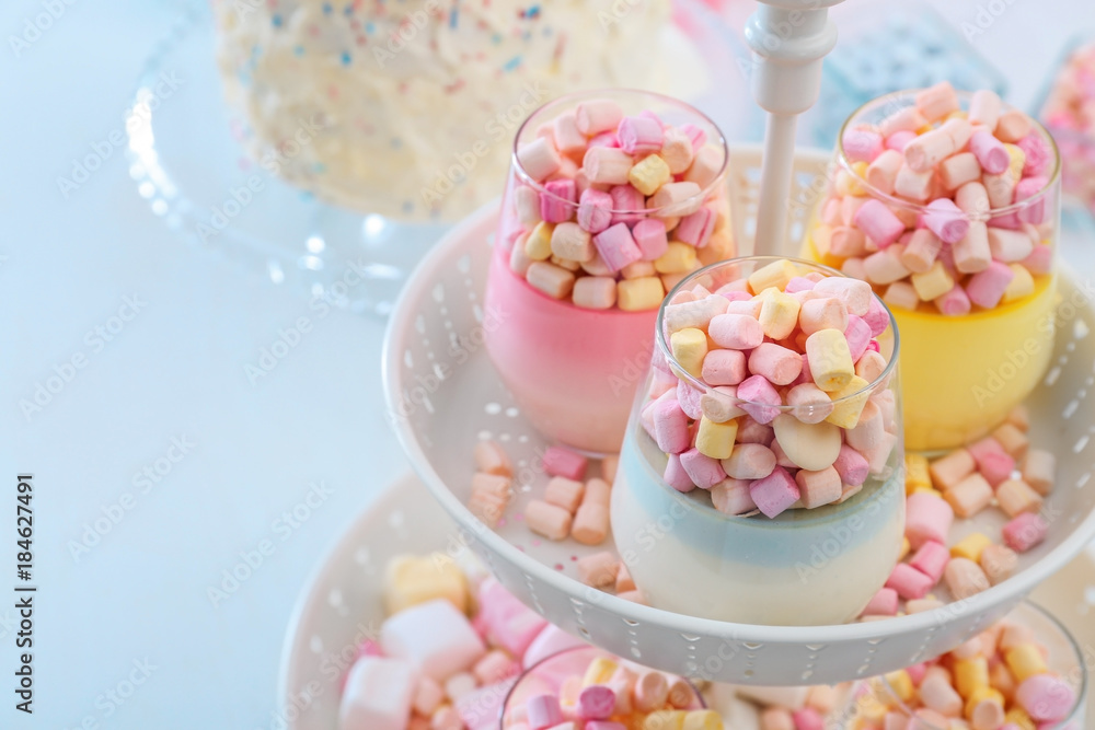 Delicious marshmallow desserts on stand, closeup