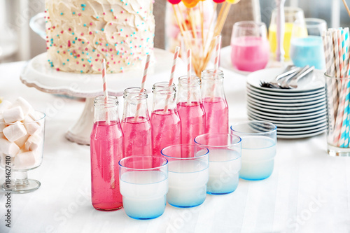 Glassware with colorful drinks on buffet table