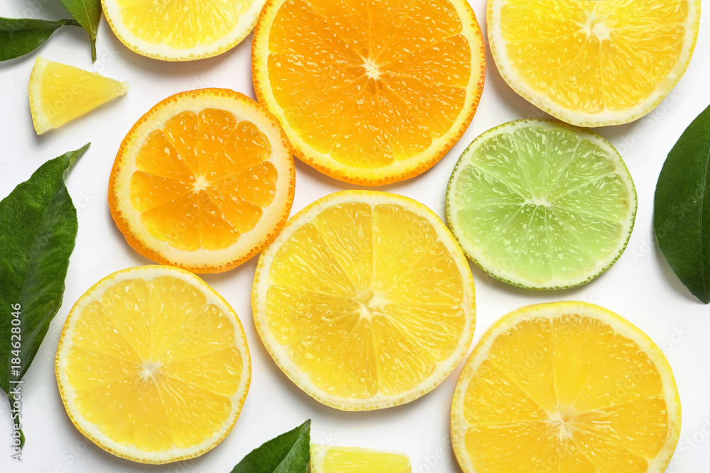 Composition with lemon, lime and orange slices on white background