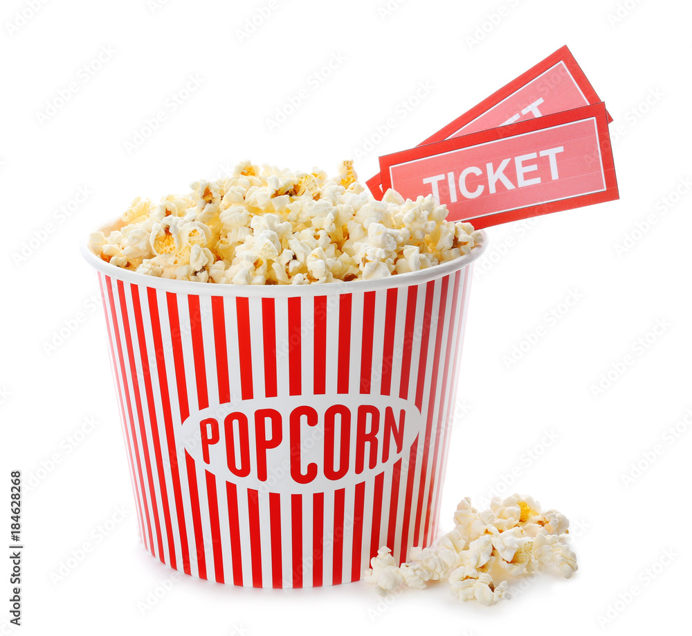 Cup with popcorn and cinema tickets on white background Cup with popcorn and cinema tickets on white background
