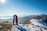 couple kissing on the mountains