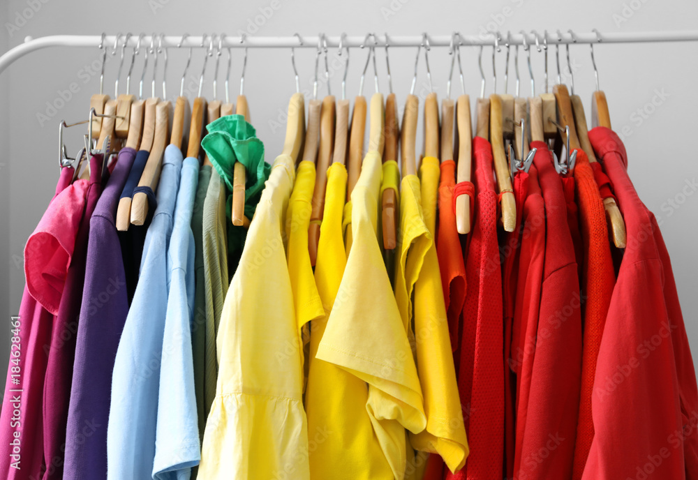 Rack with rainbow clothes, close up Rack with rainbow clothes, close up