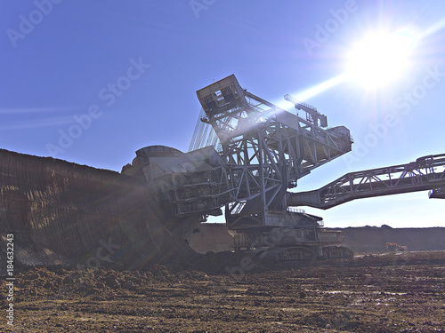 Large bucket-wheel excavator in action at lignete mine. photo