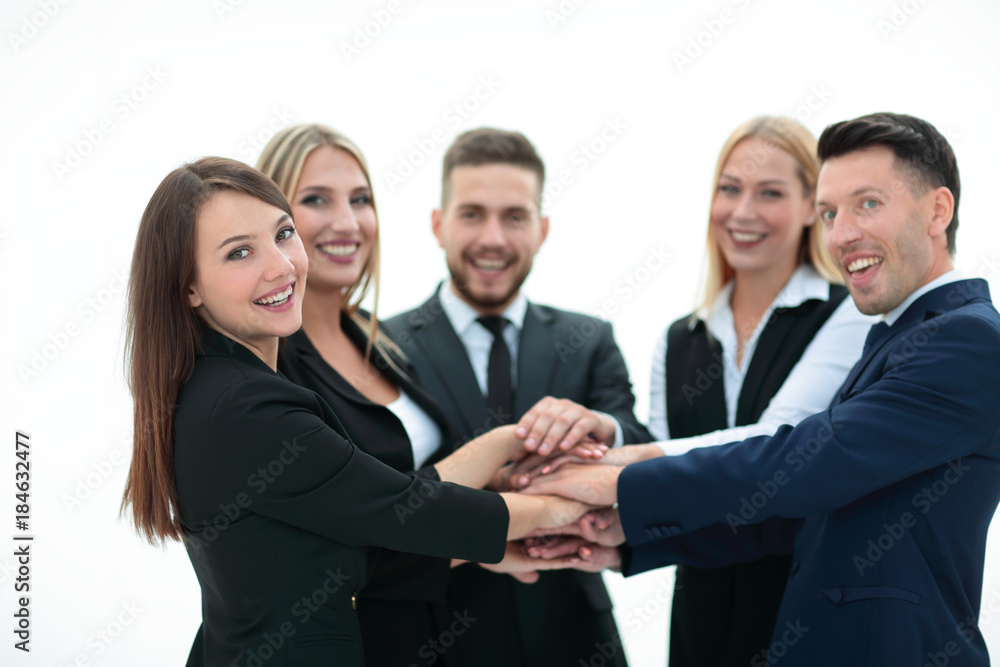 closeup.smiling business team with hands clasped together closeup.smiling business team with hands clasped together