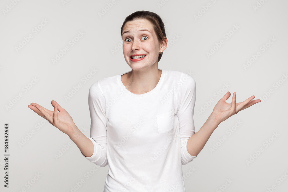 Who knows? Funny woman looking at camera Who knows? Funny woman looking at camera