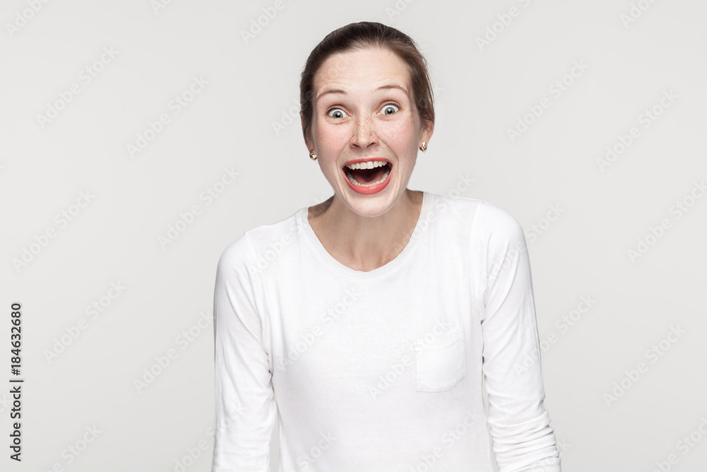 Beautiful girl toothy smiling and looking at camera Beautiful girl toothy smiling and looking at camera