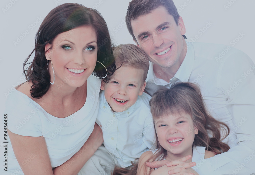Family lying down on their bed at home Family lying down on their bed at home