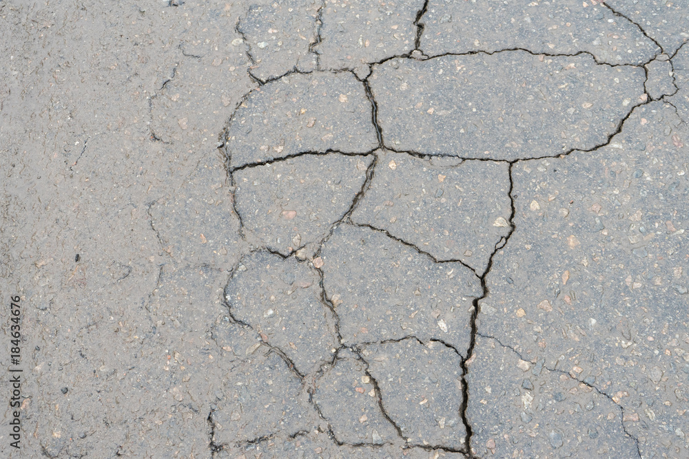 Obraz premium Cracks in the pavement. Poor road surfaces.
