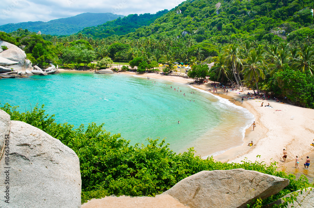 Aerial view of unidentified people enjoying the water of beach at Cabo San Juan,Tayrona Natural National Park, Colombia