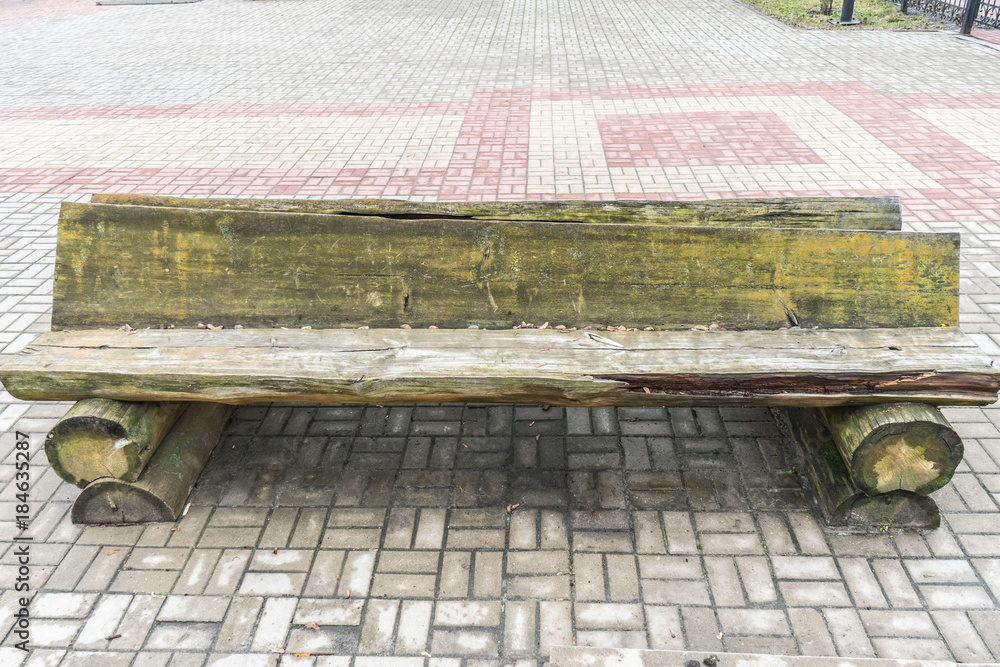 Old wooden bench in the brutal style.