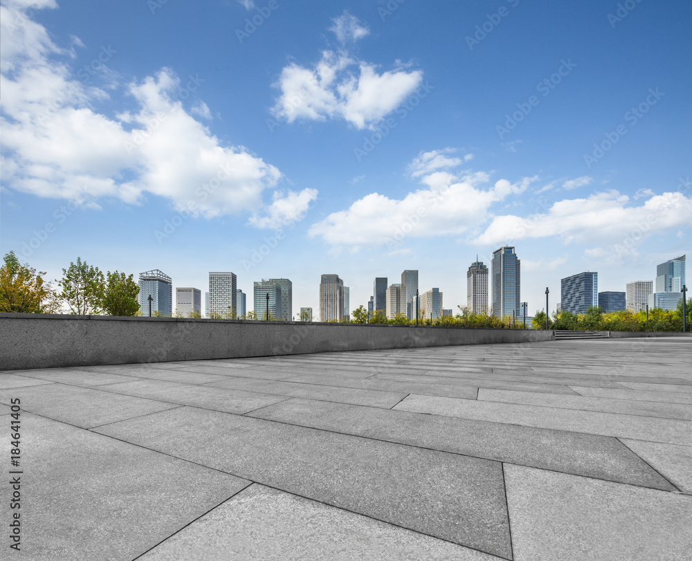 Panoramic skyline and buildings with empty square floor.