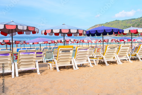 Beach chairs on the white sand beach and tropical sea in Phuket, Thailand