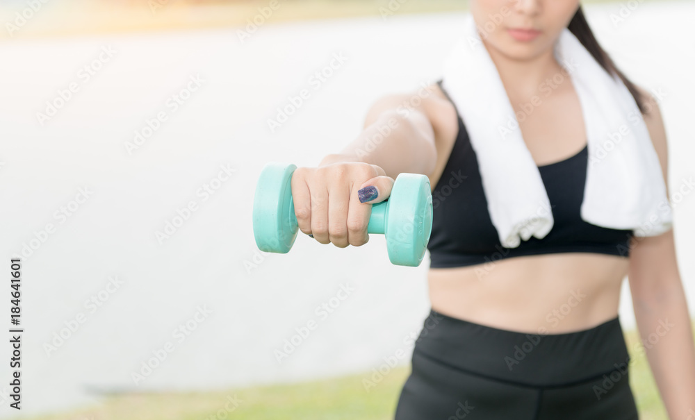 asian sporty young woman with dumbbells asian sporty young woman with dumbbells