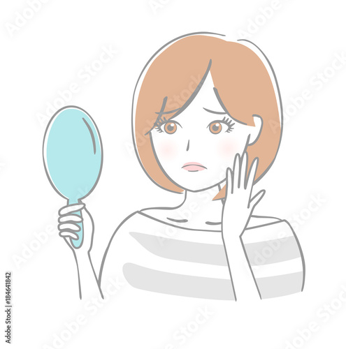 鏡を見る女性