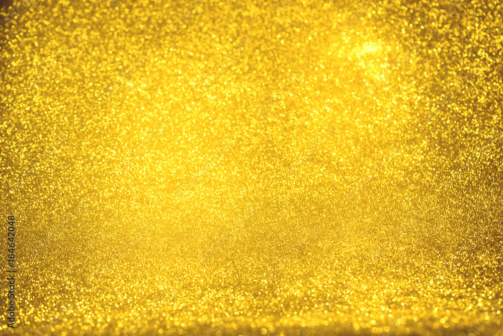 golden glitter texture Colorfull Blurred abstract background for birthday, anniversary, wedding, new year eve or Christmas.