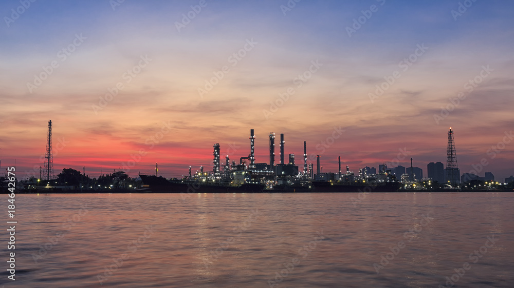 oil refinery along the river at sunrise