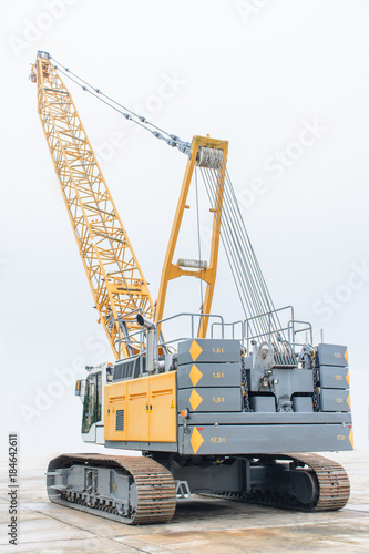 photo of huge crawler crane with isolated background