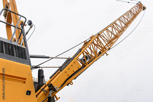 Bild auf Leinwand arm of huge crawler crane with isolated background