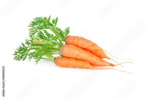 fresh baby carrot with stem on white background