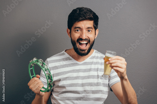 Portrait of Brazilian guy wearing carnival costume photo