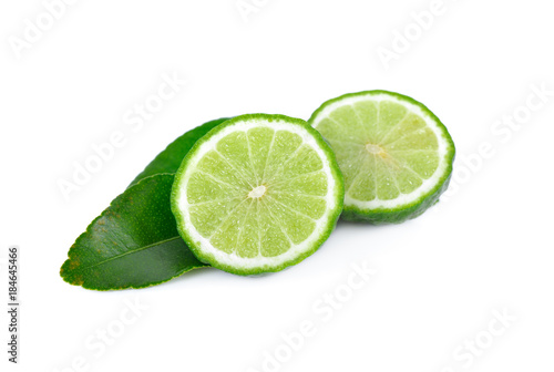 half cut fresh bergamot with leaf on white background