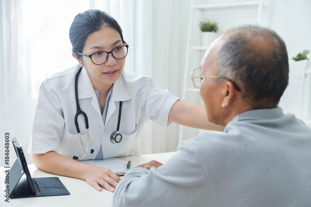 Female doctor comforting senior male patient. Female doctor comforting senior male patient.