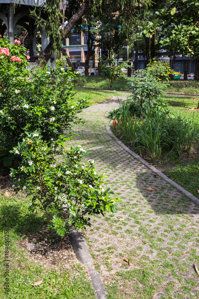 Brick block with small trees inserted.