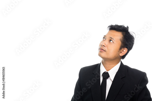 Portrait of a business man thinking with suit. Isolated on white background