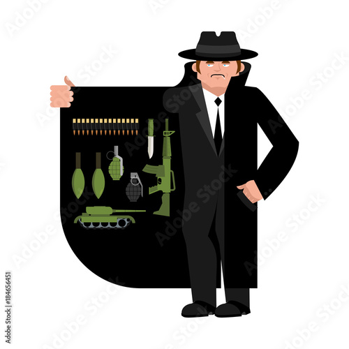Smuggler selling weapon. Gun and warheads. Ammunition and grenade. Cloak-seller isolated. Dealer in hat and coat . Bootlegger. Seller prohibited goods of black marke. Legitimate trade.  