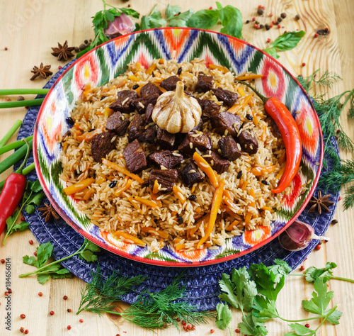 Pilaf with mutton, carrots, onions, garlic, pepper and cumin. A traditional dish of Asian cuisine.