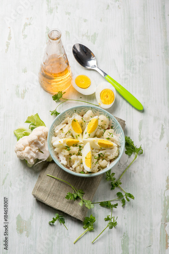 cauliflower salad with boiled eggs and parsley