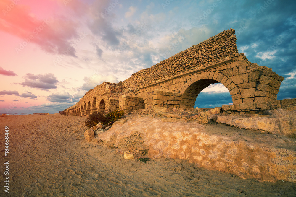 Old Aqueduct on the beach in Caesarea, Israel