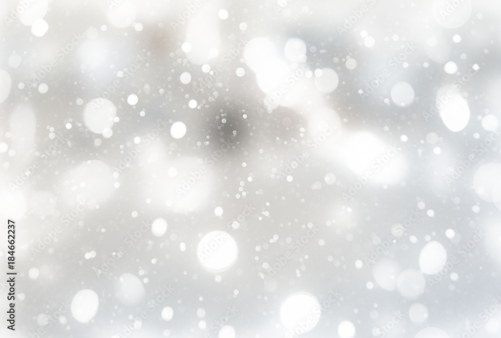 Fototapeta Festive holiday background with light delicate bokeh effect and drawing Decorative snow.
