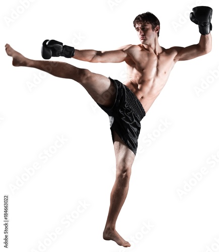 Male Boxer / Kickboxer Performing a Kick