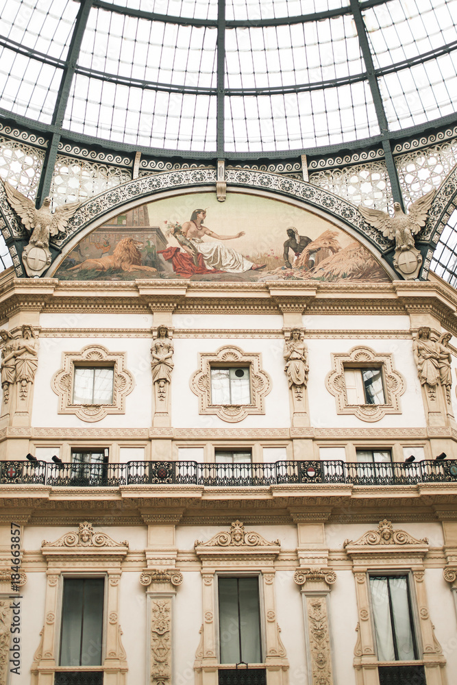 MILAN, ITALY - NOVEMBER 6: Unique closeup view of Galleria Vittorio Emanuele II. Built in 1875 this gallery is one of the most popular shopping areas in Milan. MILAN, ITALY - NOVEMBER 6: Unique closeup view of Galleria Vittorio Emanuele II. Built in 1875 this gallery is one of the most popular shopping areas in Milan.