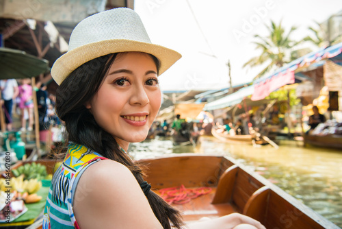 woman traveler taking boat visiting Thailand © PR Image Factory