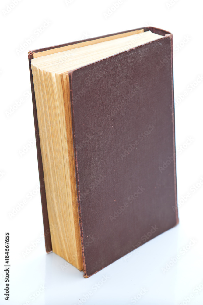 One old book with yellow pages isolated on white One old book with yellow pages isolated on white