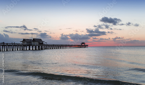 pier jetty at sunset in Naples, forida, usa photo