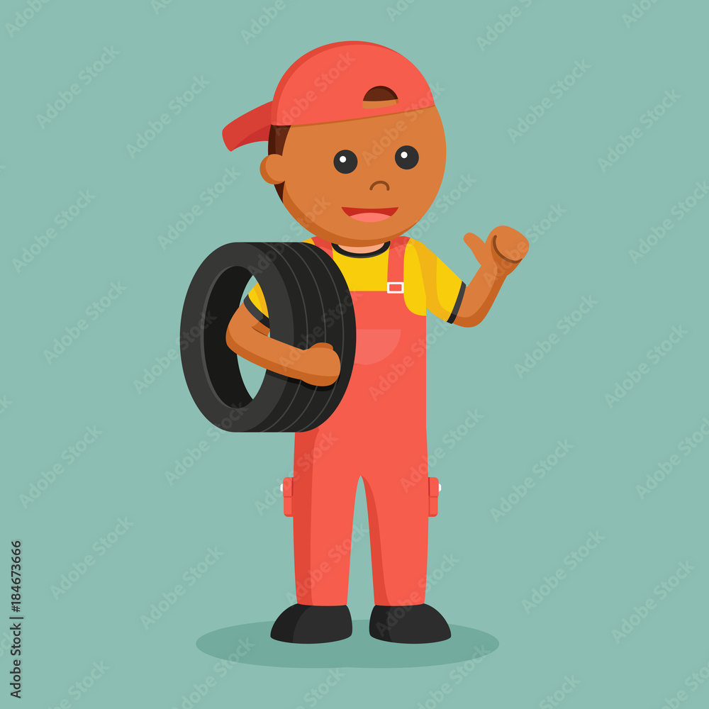 African mechanic carrying tire